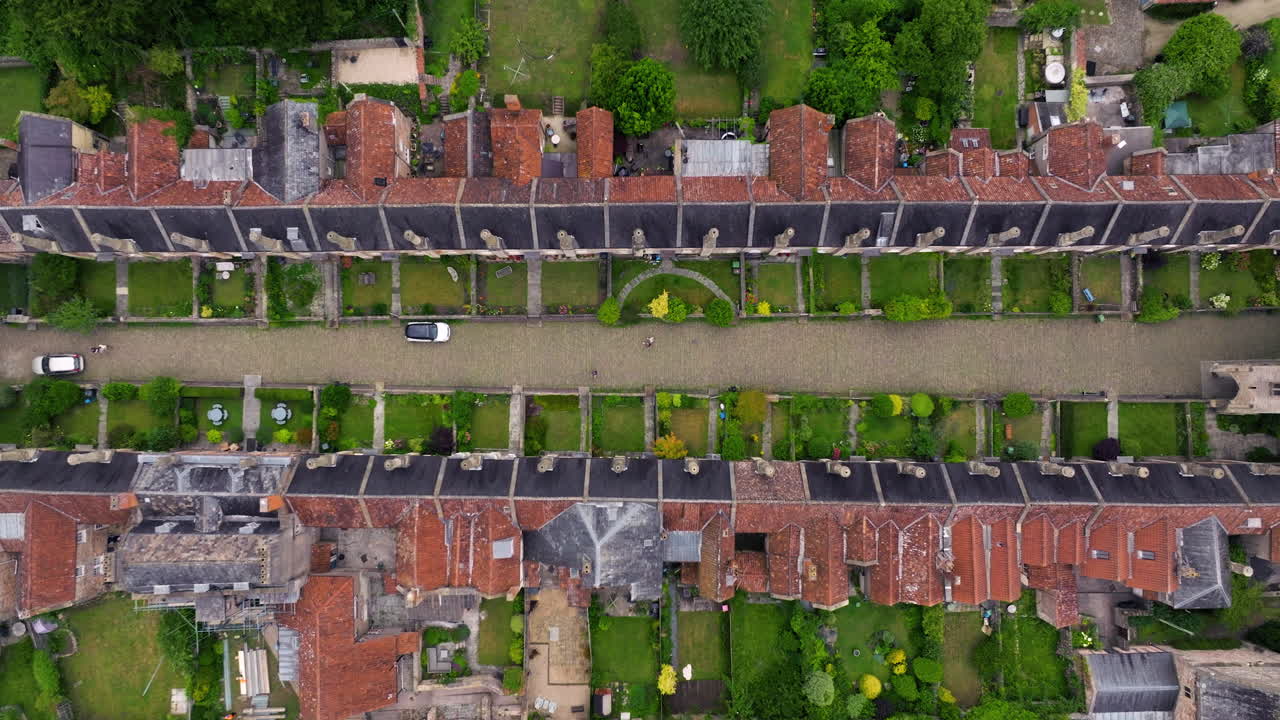 Top View Of The Oldest Residential Street Of Vicar's Close In Wells, Somerset, England. Aerial Ascending Shot
