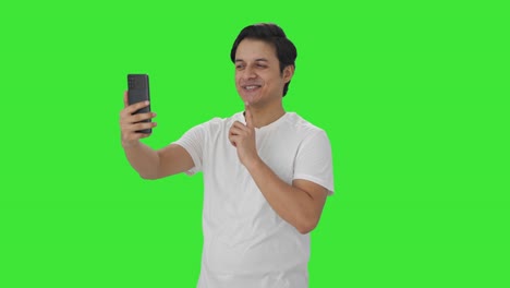 Happy-Indian-man-talking-on-video-call-Green-screen