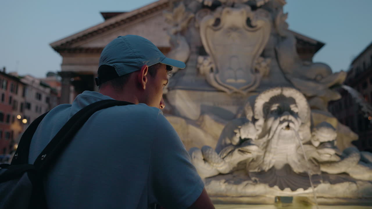 Man admiring the Pantheon and fountain in Rome