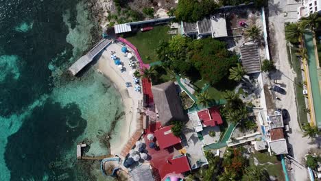 A-drone-shot-of-a-beautiful-Beach-Club-on-the-beautiful-island-of-Isla-Mujeres-Mexico