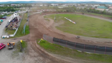 4K-Drone-Video-of-Auto-Racing-at-Mitchell-Raceway-in-Fairbanks,-AK-during-Sunny-Summer-Evening