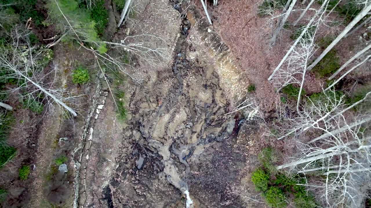 mountain pond after earthen dam break during hurricane helene near boone nc