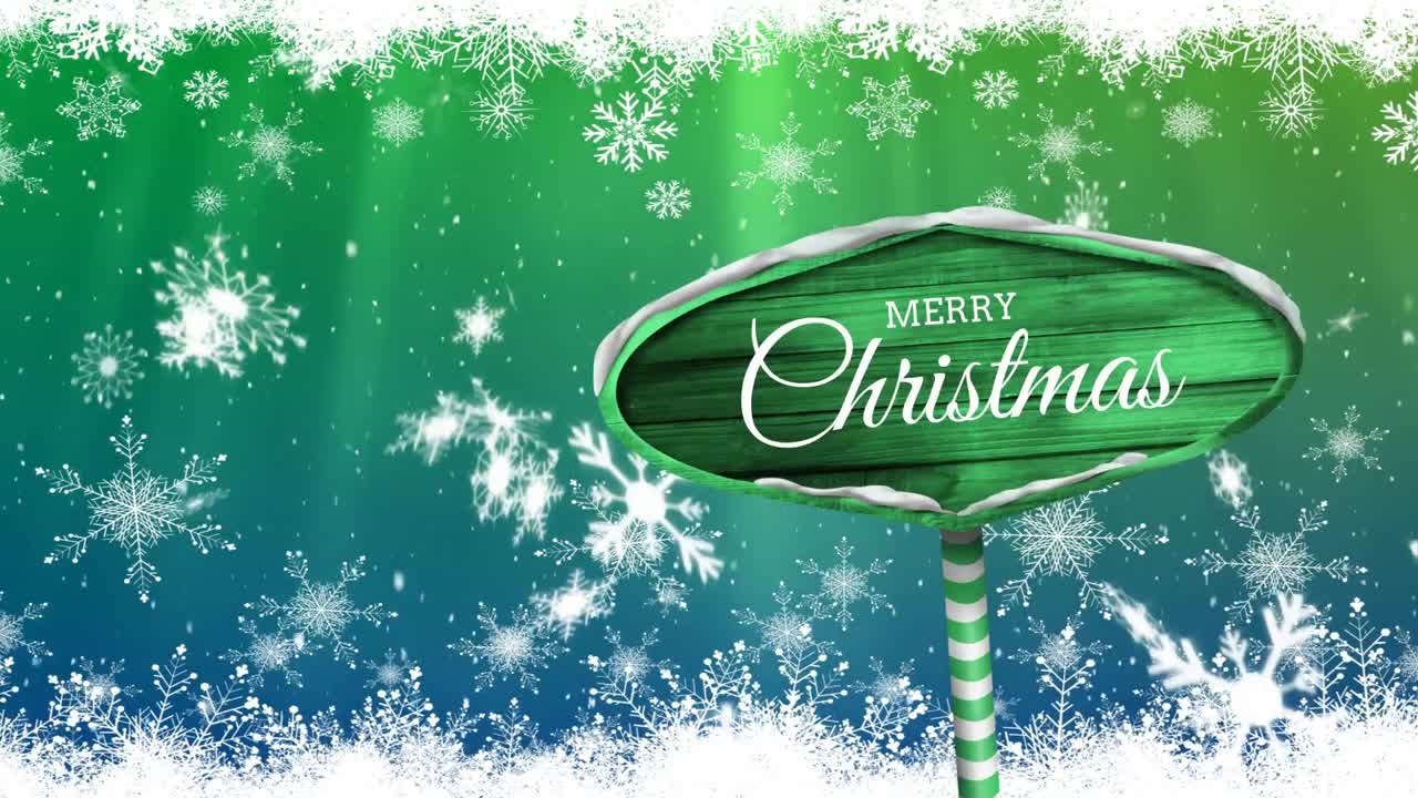 눈이 내리는 나무 표지판에 쓰여진 메리 크리스마스