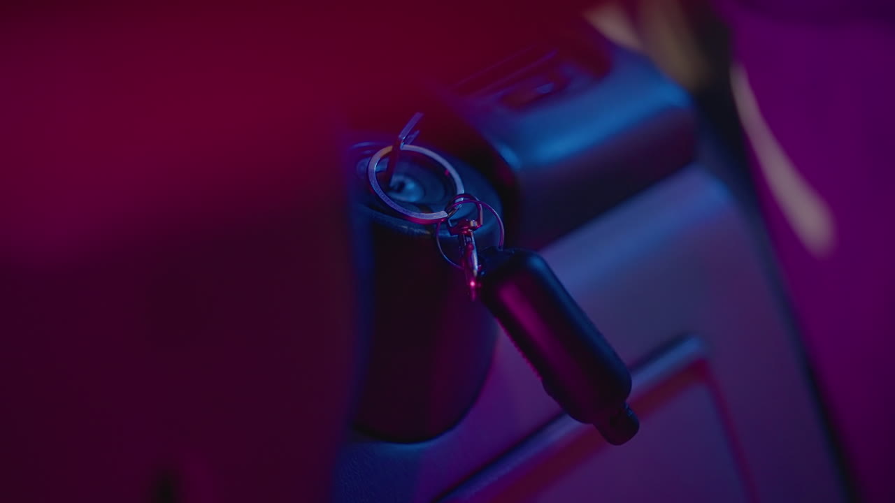 Bright neon hues showcase tranquil vehicle interior with glowing key fob scene, Serene nighttime setting emphasizing silent vehicle interior and vibrant glowing key fob through neon lighting