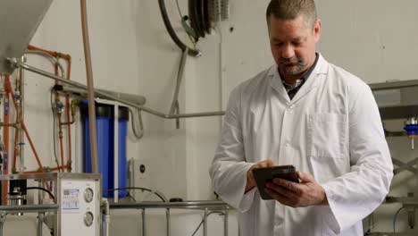 male worker using digital tablet in factory 4k