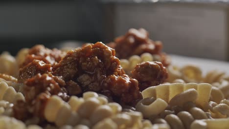 steaming pasta with bolognese sauce, close up view