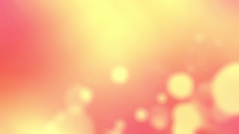 abstract blurry glowing orange background with yellow bokeh.