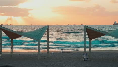 static slow motion shot of waves crashing onto sea beach at golden hour