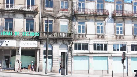 Colorful urban street art on old buildings in the Praça de Gomes Teixeira, Porto