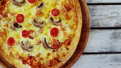 baked pizza on wooden board