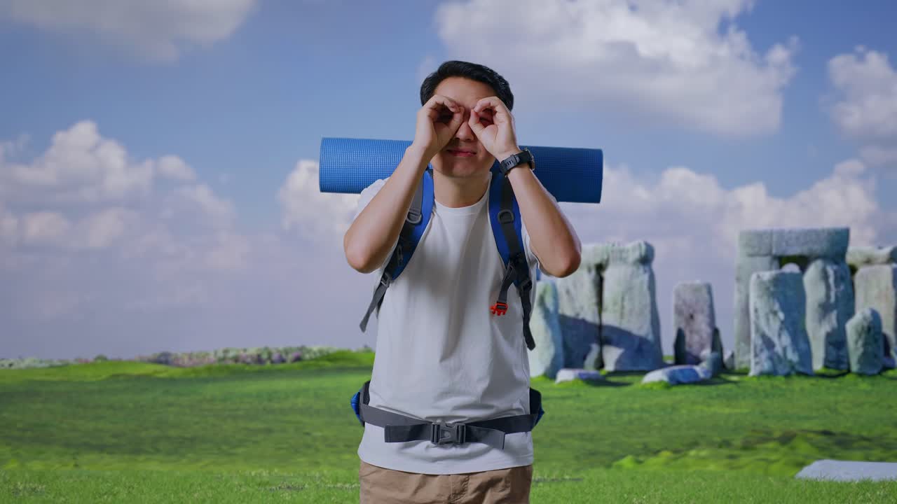 Man with Backpack Looking at Stonehenge