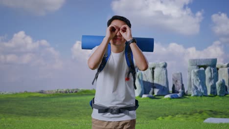 Man with Backpack Looking at Stonehenge