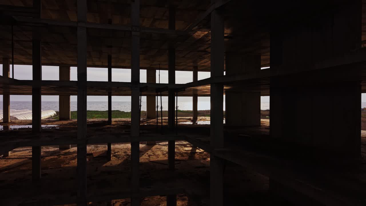 Exploring an abandoned building at sunset near the coast