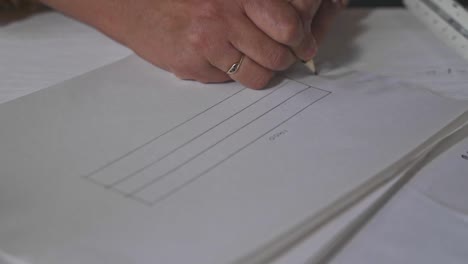 workshop woodworker drawing a bench slow motion