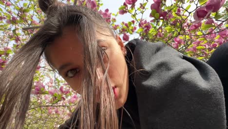 woman in a park with magnolias