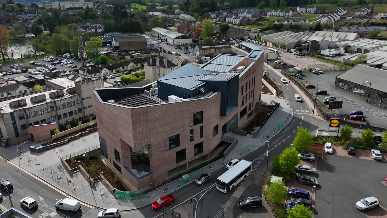 Aerial View of a Modern Brick Building in a Town