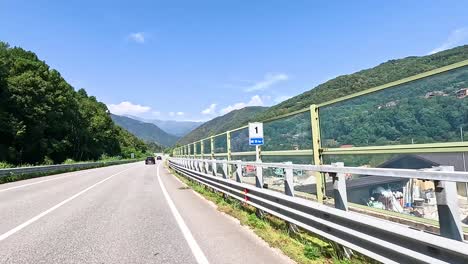 driving through lush, mountainous piedmont scenery