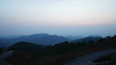 timelapse sunset with mountain layer and beautiful road in thailand