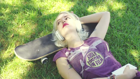 young woman relaxing in the shade of tree