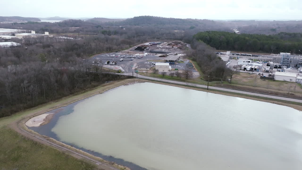 Aerial drone footage flying over the retention ponds of a chemical plant outside of the city of Chattanooga, TN.