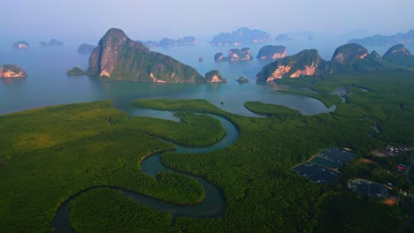 small orbit drone shot of samet nangshe, one of most famous place in south of thailand with mangrove forest and limestone mountains in andaman sea