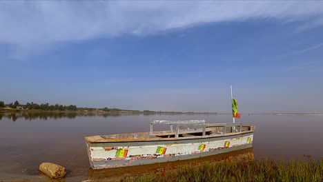 Old-Wooden-Boat-Docked-At-The-Shore-Of-Lake-Retba-In-Senegal-Peninsula,-Northwest-Africa