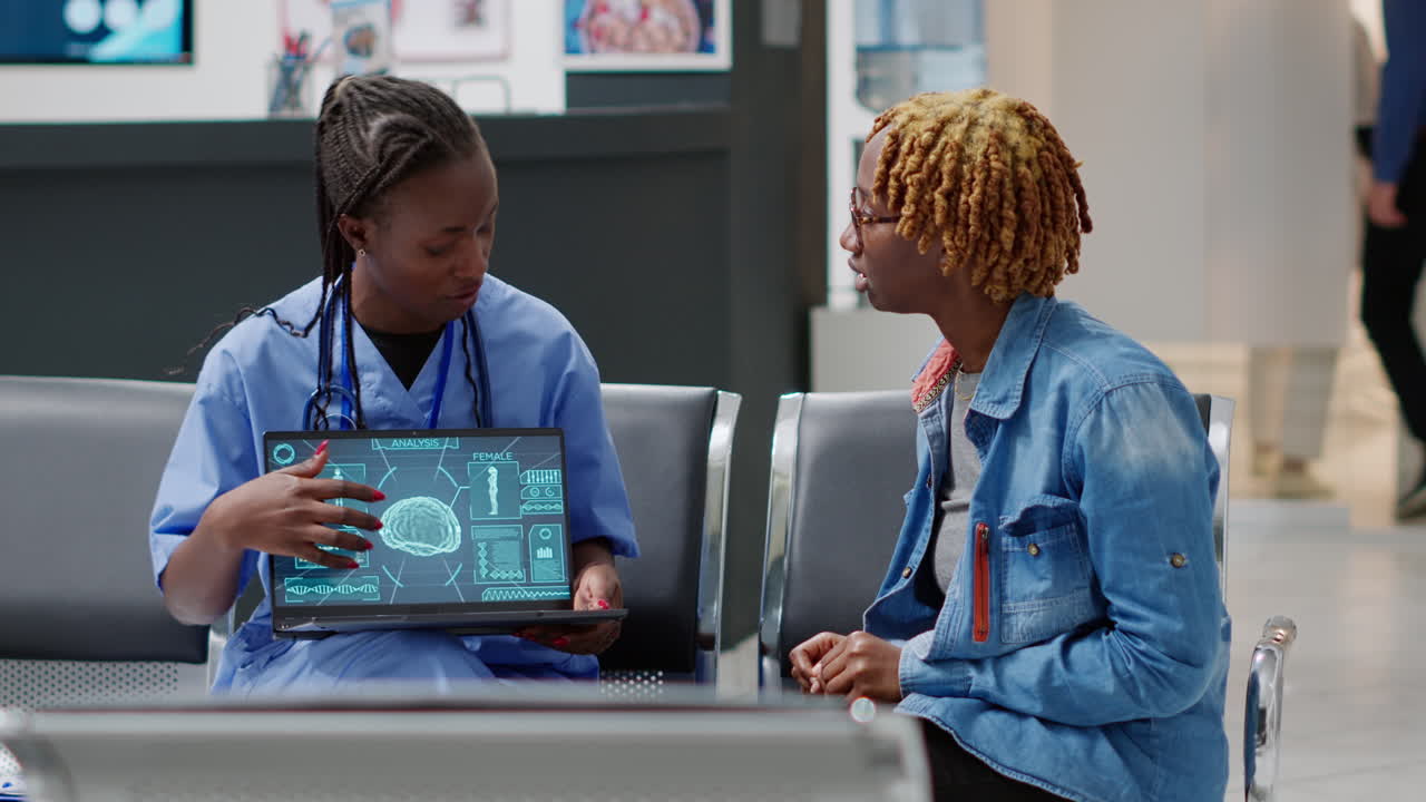 Doctor consulting with patient in hospital waiting room