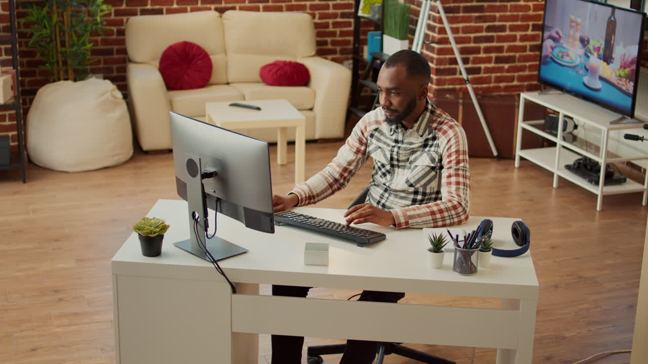 African american man working on computer at desk