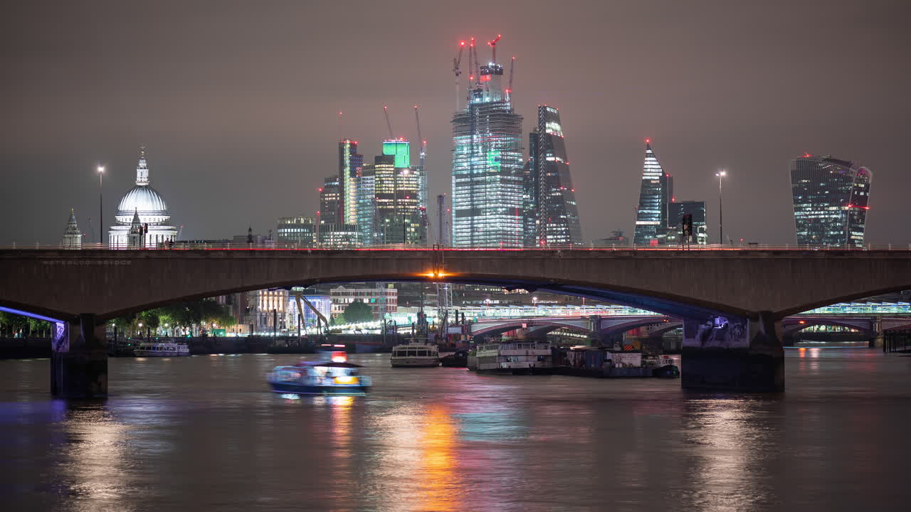 Time-lapse of traffic on Waterloo Bridge and London skyline in the background