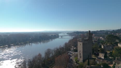 Aerial-view-above-the-scenic-old-town-of-Avignon-with-the-Philippe-le-Bel-Tower-and-Rhône-river