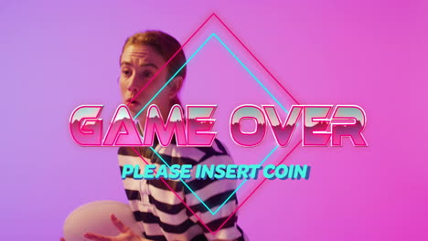woman standing behind neon game over text in retro gradient tech studio, featuring diamond shapes