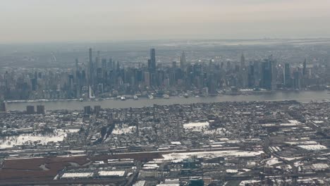new york city winter skyline with hudson river view from plane window