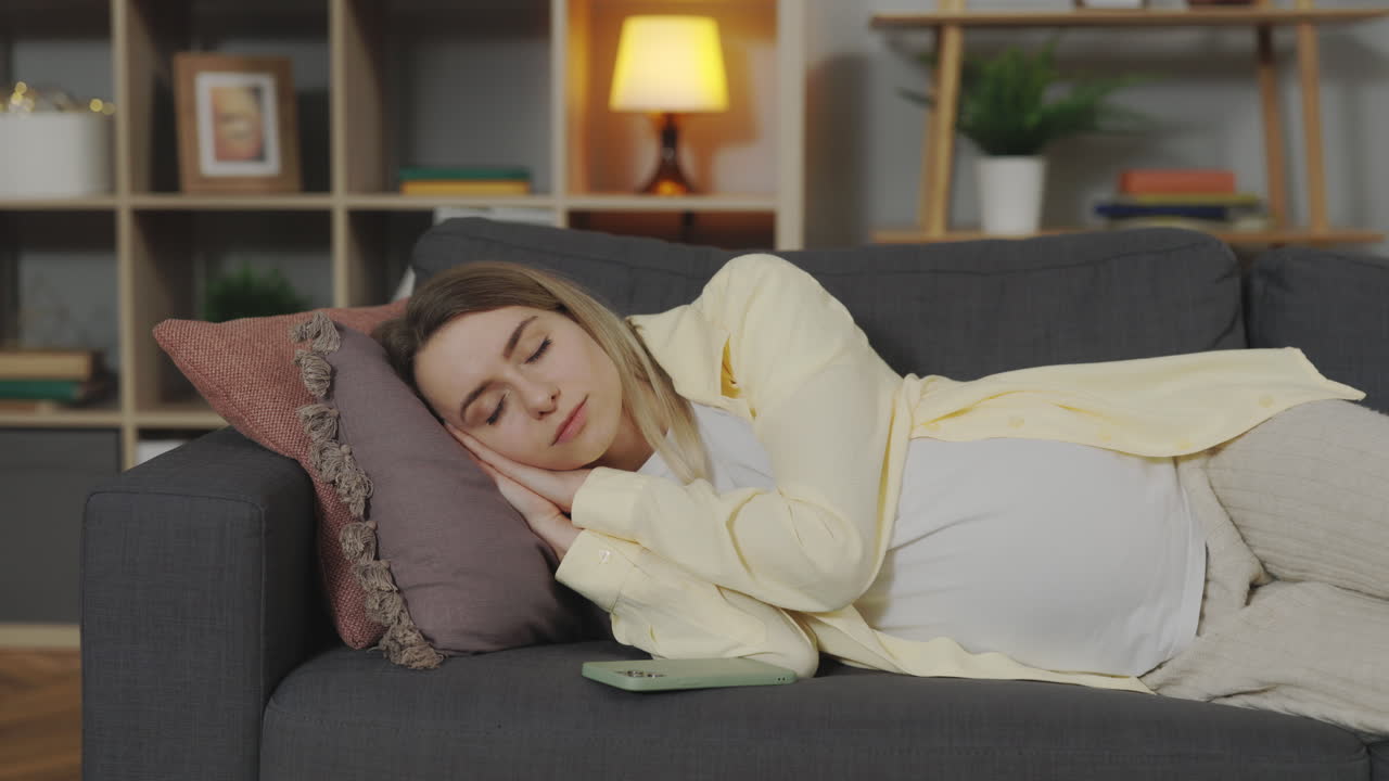 Pregnant Woman Sleeping on Couch