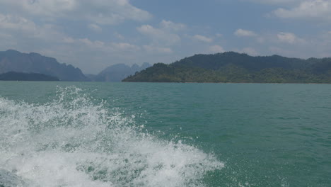 A-fast-boat-driving-through-the-sea-of-Koh-Phi-Phi,-Thailand