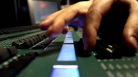 Male-Hands-Using-Sound-And-Light-Digital-Mixer-At-A-Concert-2