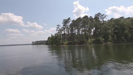 white clouds blue sky boat ride on lake low angle shot degray lake arkansas usa