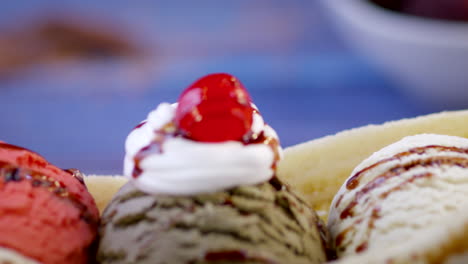 banana split ice cream with strawberry, chocolate and vanilla