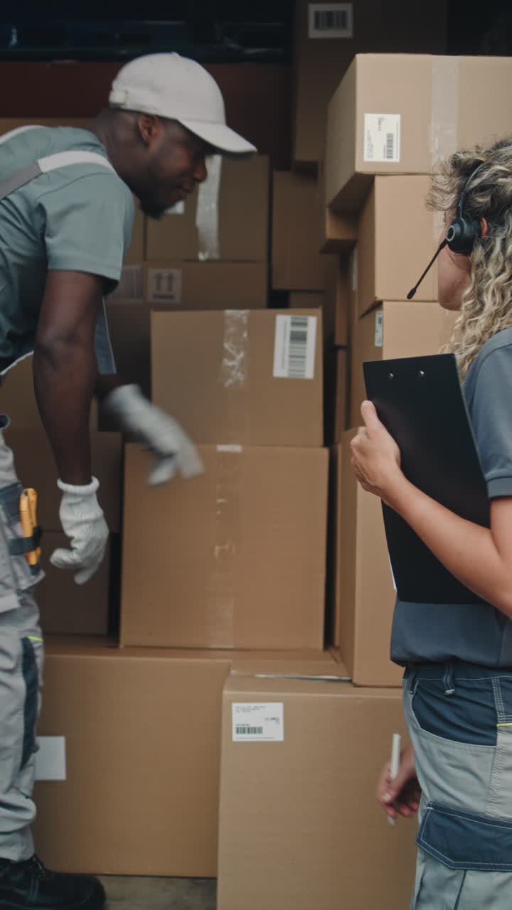 Logistics workers handling packages in a delivery truck