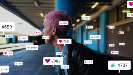 surrounded by social media icons, person with pink hair creating animation content