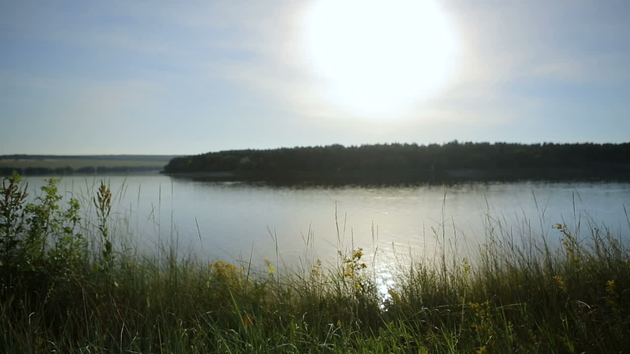 Cyclist Riding At Sunset. Mountain bike cyclist riding single track at sunset