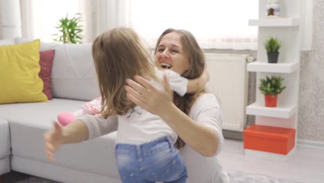 Mother-daughter-hugging-in-slow-motion.