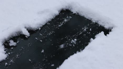 hand cleaning snow