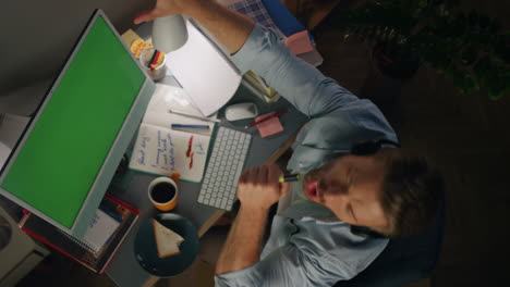 Positive-man-singing-dancing-at-home-workplace-top-view.-Guy-listening-music