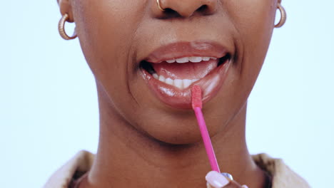 Black-woman,-face-and-lip-gloss-with-kiss