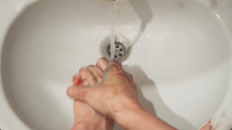 cleaning hands after painting session