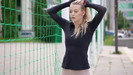 woman in sportswear near soccer net