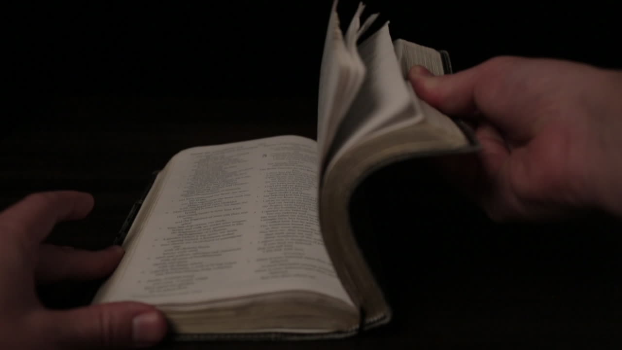 Caucasian Male Slow Motion Flipping Through Pages