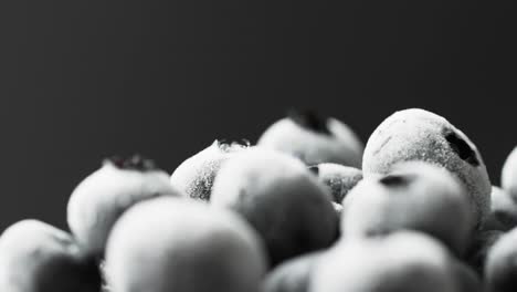 micro video of blueberries with copy space on black background