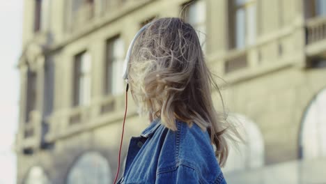 closeup attractive young woman using headphones