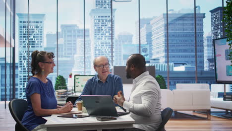 elderly people meeting with a financial planner to develop a retirement strategy